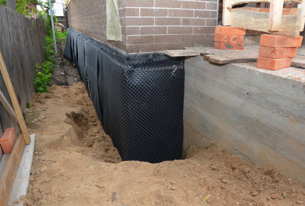 SJ Waterproofing Pros technician performing targeted Foundation Crack Repair assessment in Ellicott City, MD